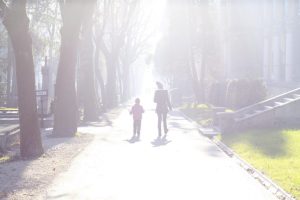 Parent and child walking. Daily devotional