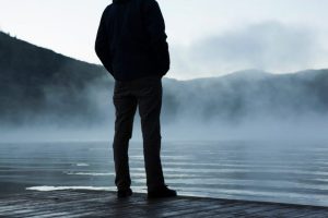 Man alone son friend fog