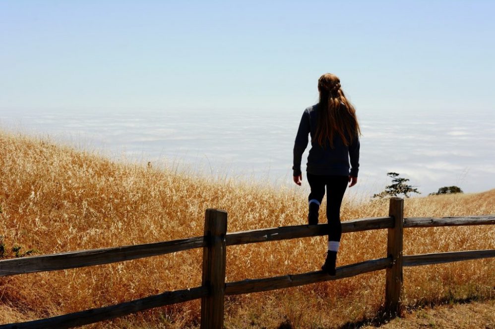 woman reflecting autum pasture