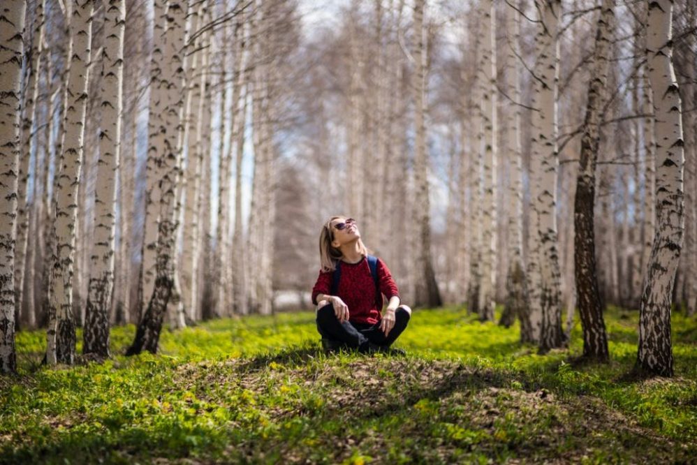 feature women in woods happy