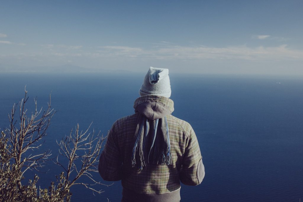 Back of man looking over a valley