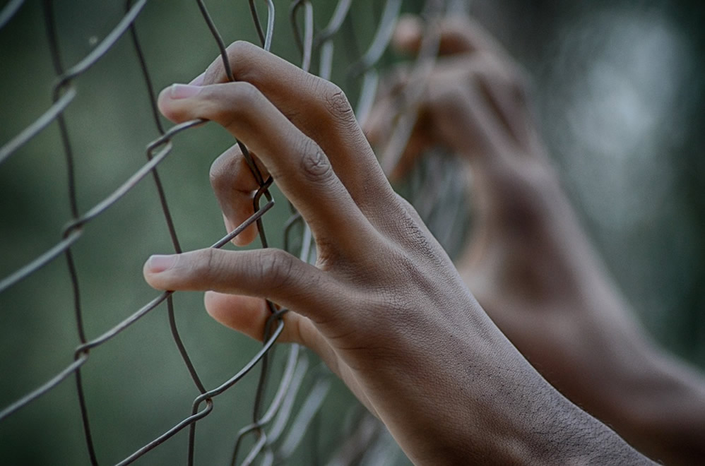 In prison, sentenced to death